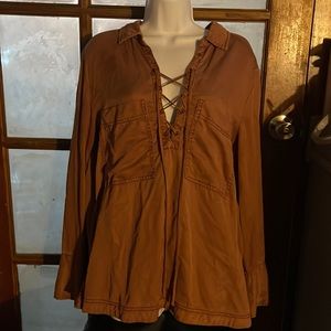 NBW Free People Size Lrg Blouse Camel/tan  has long sleeves,